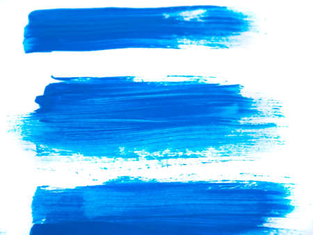 Blue acrylic paint stroke isolated on white background, abstract art conceptの写真素材