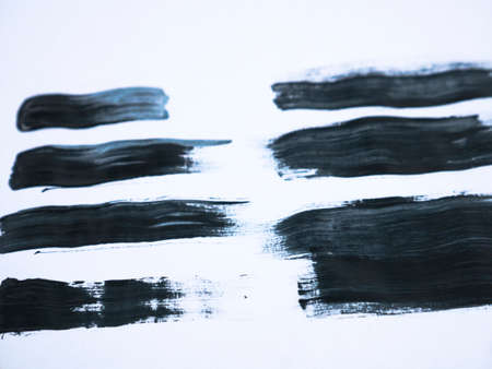 Black acrylic paint stroke isolated on white background, abstract art conceptの写真素材