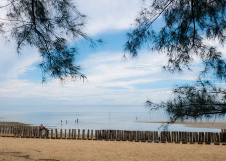 Beach sands landscape in bright sunny day with white clouds on blue skyの写真素材