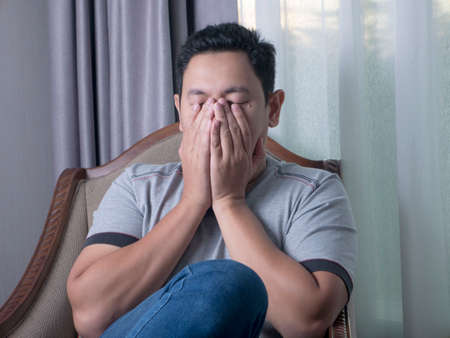 Young Asian man crying expression. Sadness frustration conceptの写真素材