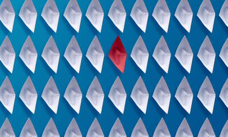 Individuality be different concept, red origami paper boat and white boats, taking different success...