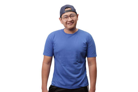 Young Asian man wearing blue shirt smiling and laughing happily expression.  Isolated on whiteの写真素材