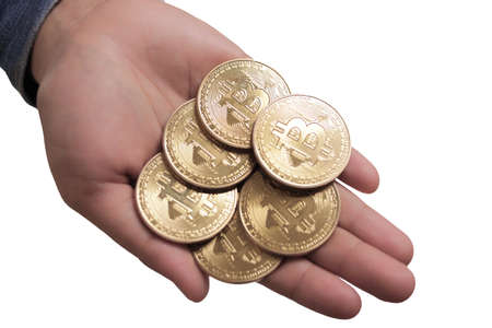 Physical bitcoin currency coins stack on hands, investment in cryptocurrency concept