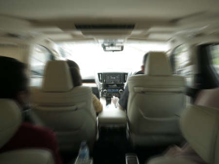 August 8th, 2019, Jakarta, Indonesia. Inside minibus car with zoomed motion blur, people car...