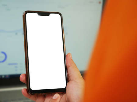 Close up image of smart phone mockup, businessman holding phone with white screen templateの写真素材
