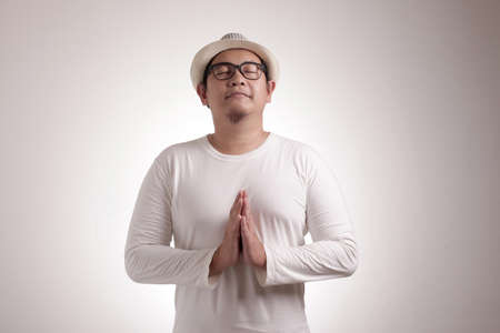 Portrait of Asian man doing relaxing yoga, serene calm relax concept
