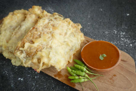 Gorengan tempe, Indonesian fried tempe snack, served with sambal or chili sauce and chilli pepper,...