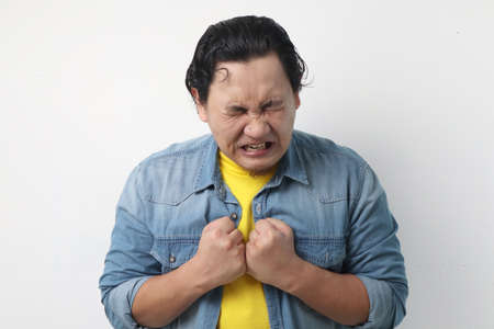 Photo image of funny Asian man crying close his eyes, sad depression frustration hopeless expression