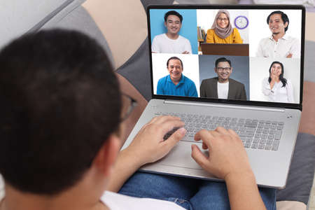 Teleconference during work from home due to coronavirus covid pandemic. Webcam pc screen views...