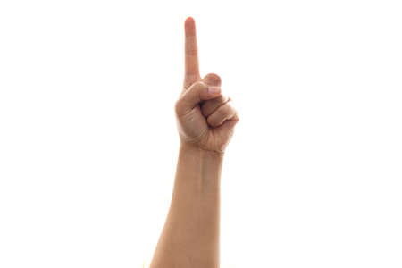 Gesture of hand showing number one with fingers or pointing up isolated on whiteの写真素材