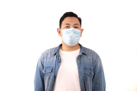 Man wearing protective facial mask. Nwe normal concept. Close up head shot portrait isolated on white with copy spaceの写真素材