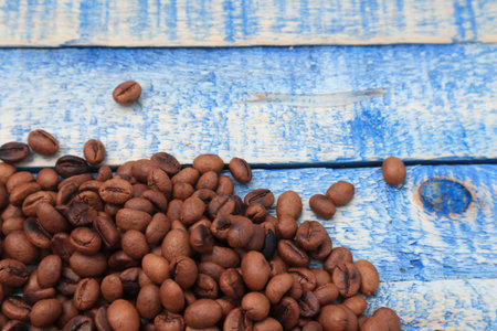 Roasted coffee beans background, on blue wooden board with copy spaceの写真素材
