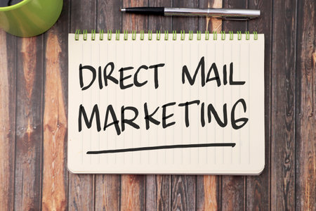 Direct Mail Marketing, text words typography written on book against wooden background, business marketing motivational inspirational conceptの写真素材