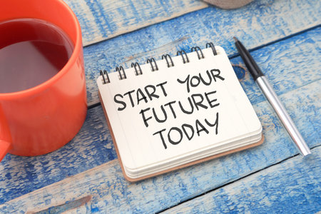Start your future today, text words typography written on book against wooden background, life and business motivational inspirational conceptの写真素材