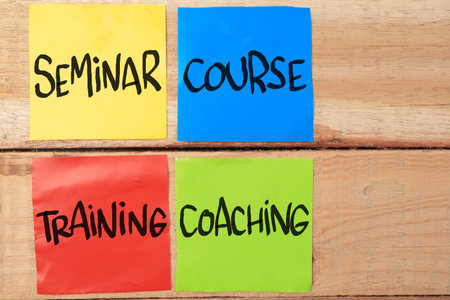Seminar Course Training Coaching, text words typography written on paper against wooden background, business self development motivational inspirational conceptの写真素材