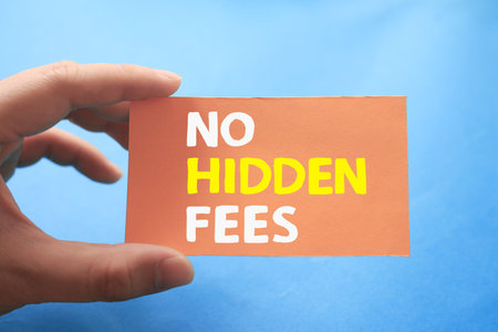 No hidden fees, text words typography written on paper against blue background, life and business motivational inspirational conceptの写真素材