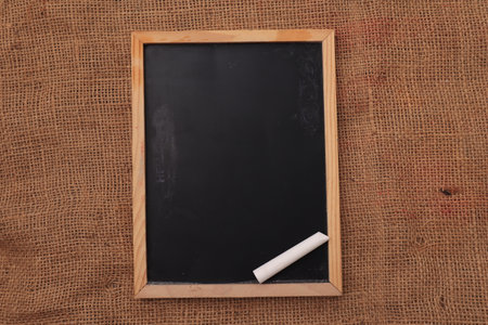 Empty blank chalkboard blackboard template on wooden background for your writing design, copy space....