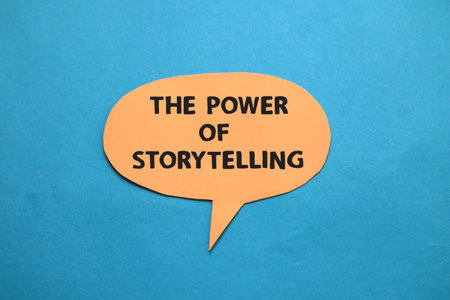The power of storytelling, text words typography written on paper against blue background, life and business motivational inspirational conceptの写真素材