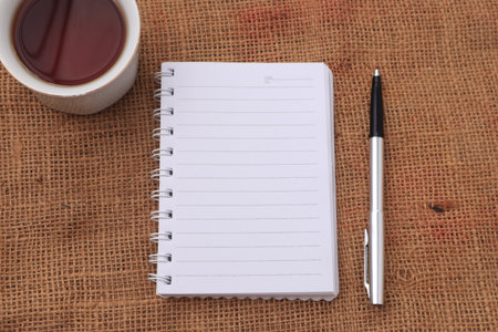 Empty blank book paper template on wooden background for your writing design, copy space. Top view flat lay conceptの写真素材
