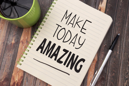 Make today amazing, text words typography written on book against wooden background, life and business motivational inspirational conceptの写真素材