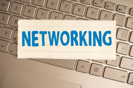 Networking, text words typography written on paper against computer keyboard, life and business motivational inspirational conceptの写真素材
