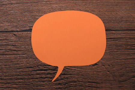 Empty blank color paper speech bubble balloon dialog for your design, flat lay top view conceptの写真素材