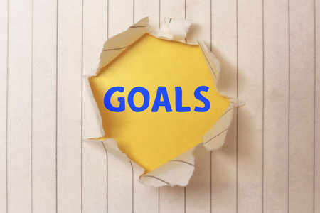 Goals, text words typography written on torn paper, life and business motivational inspirational conceptの写真素材