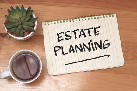 Estate planning, text words typography written on book against wooden background, life and business motivational inspirational conceptの写真素材