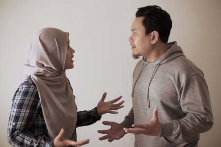 Asian muslim couple husband and wife having fight, argue and ignoring on each other, bad relationship in marriage conceptの写真素材