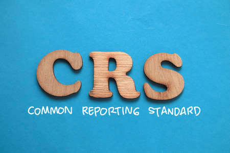 CRS Common Reporting Standard, text words typography written on blue background, life and business motivational inspirational conceptの写真素材