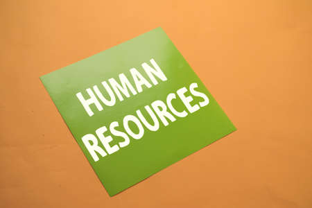 Human resources, text words typography written on paper against yellow background, life and business motivational inspirational conceptの写真素材