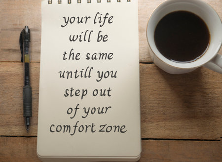 Leave Comfort Zone, text words typography written on book against wooden background, life and business motivational inspirational conceptの写真素材