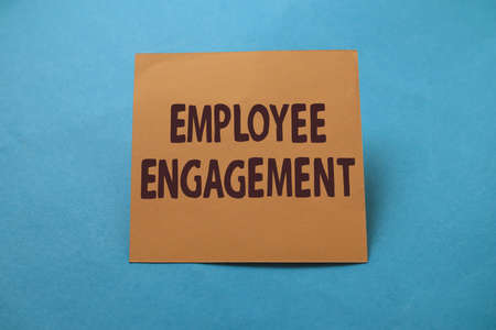 Employee engagement, text words typography written on paper against blue background, life and business motivational inspirational conceptの写真素材