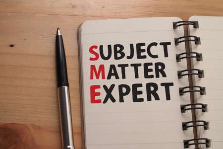 Subject Matter Expert, text words typography written on book against wooden background, life and business motivational inspirational conceptの写真素材