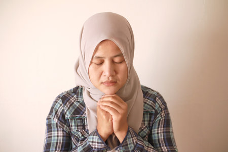 Sad depressed anxiety Asian muslim woman thinking contemplating bad thing happened in her life, stress exhausted feeling down expression, financial or relationship problem conceptの写真素材
