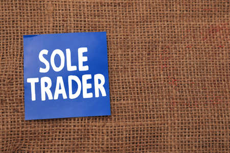 Sole Trader, text words typography written on paper against wooden background, life and business motivational inspirational conceptの写真素材