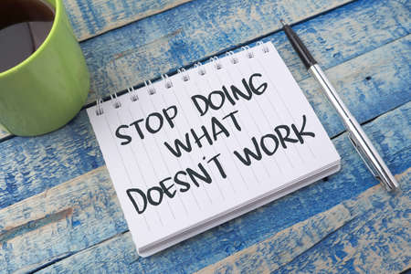 Stop doing what doesn't work, text words typography written on paper against wooden background, life and business motivational inspirational conceptの写真素材
