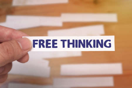 Free Thinking, text words typography written on paper against wooden background, life and business motivational inspirational conceptの写真素材