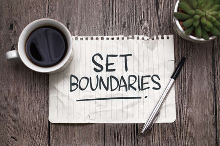 Set boundaries, text words typography written on paper against wooden background, life and business motivational inspirational conceptの写真素材
