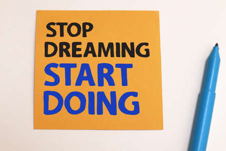 Stop dreaming start doing, text words typography written on paper, life and business motivational inspirational conceptの写真素材