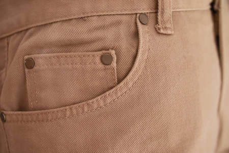 Jeans pocket with seam and thread stitches, blrown khaki denim jeans texture backgroundの写真素材