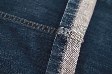 Jeans texture and stitches background. Close-up blue denim pants fabricの写真素材