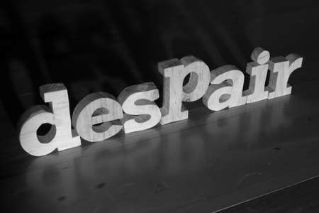 Despair, text words typography written with wooden letter on black background, life and business negativity conceptの写真素材