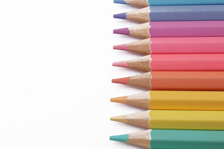 Close up of colorful colored pencils art education school supplies isolated on white backgroundの写真素材