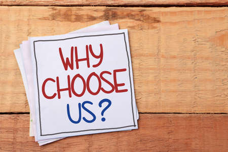 Why choose us, text words typography written on paper, business motivational inspirational conceptの写真素材