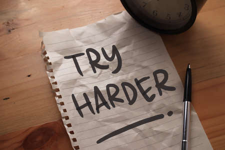 Try Harder, text words typography written on paper, success  life and business motivational...
