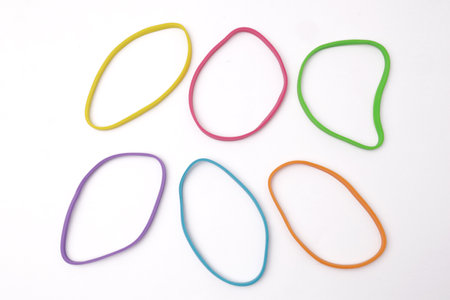 Colorful multi color elastic rubber bands isolated on white backgroundの写真素材