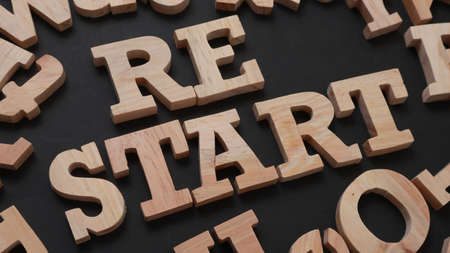 Restart, text words typography written with wooden letter on black background, life and business motivational inspirational conceptの写真素材