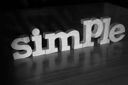 Simple, text words typography written with wooden letter on black background, life and business motivation inspirational conceptの写真素材
