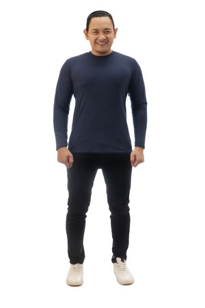 Man wearing casual blue shirt black denim and white shoes, looking at camera with confidence and smiling, front view. Full body portrait isolated cut outの写真素材